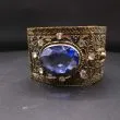 Vintage armring med facetslebet sten i himmelblå og klart glas