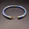 Vintage armring udført i lyseblåt cloisonné med forgyldning