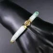 Eksklusivt fjorten karat guld og jade armbånd 

Mellemstykke 