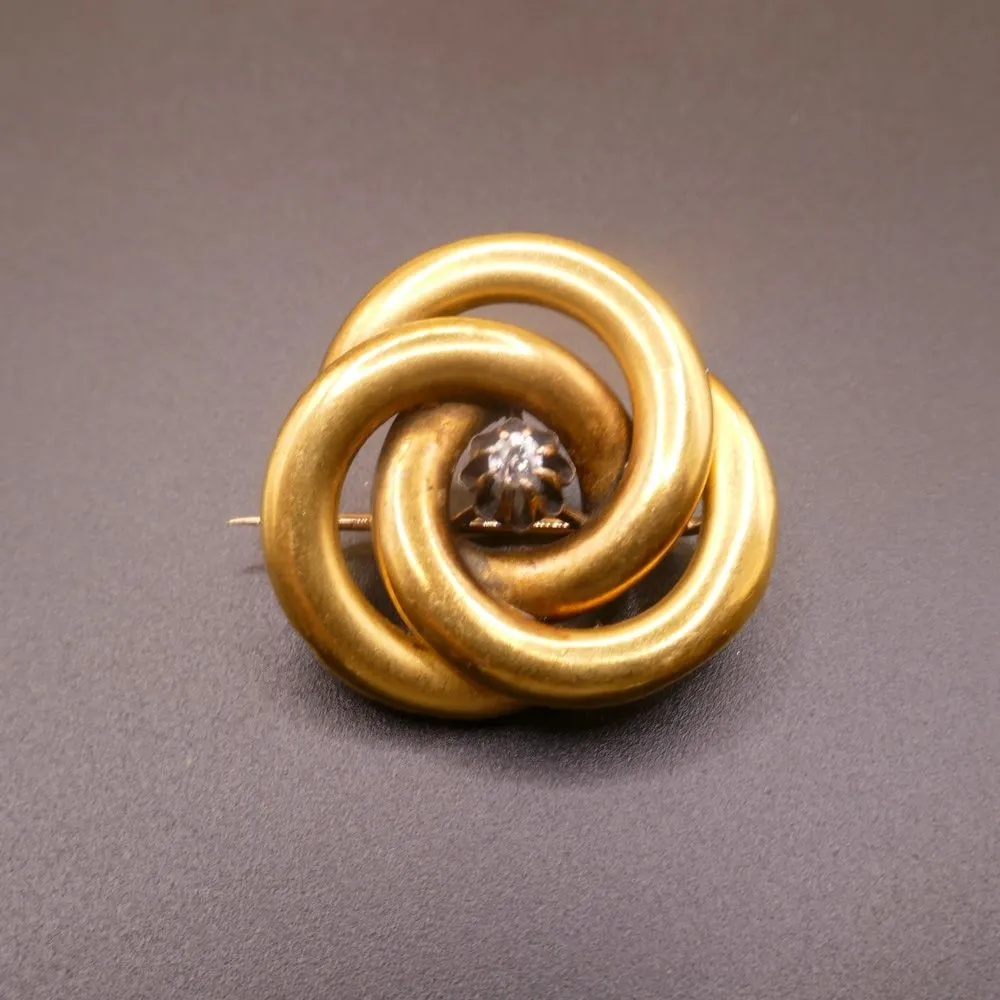 Vintage broche i fjorten karat guld med en diamant