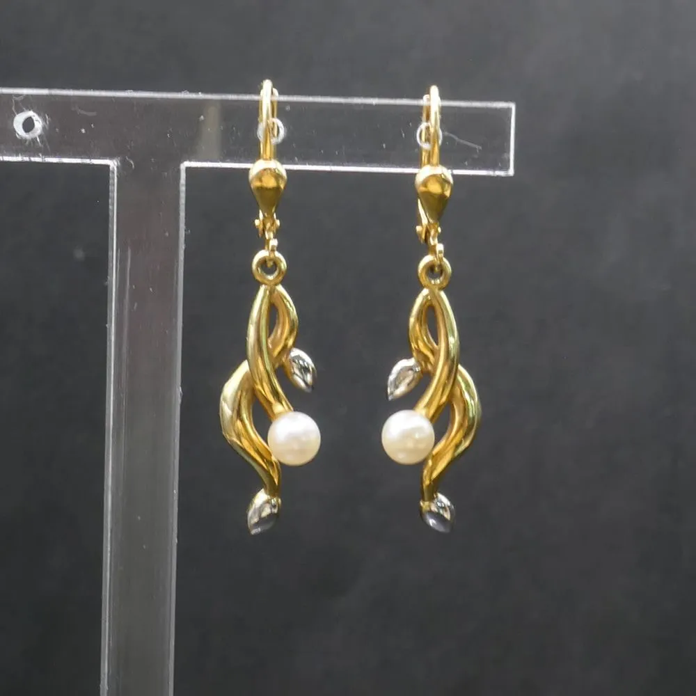 Vintage ørestikkere i tofarvet fjorten karat guld med ægte Akoya perler.