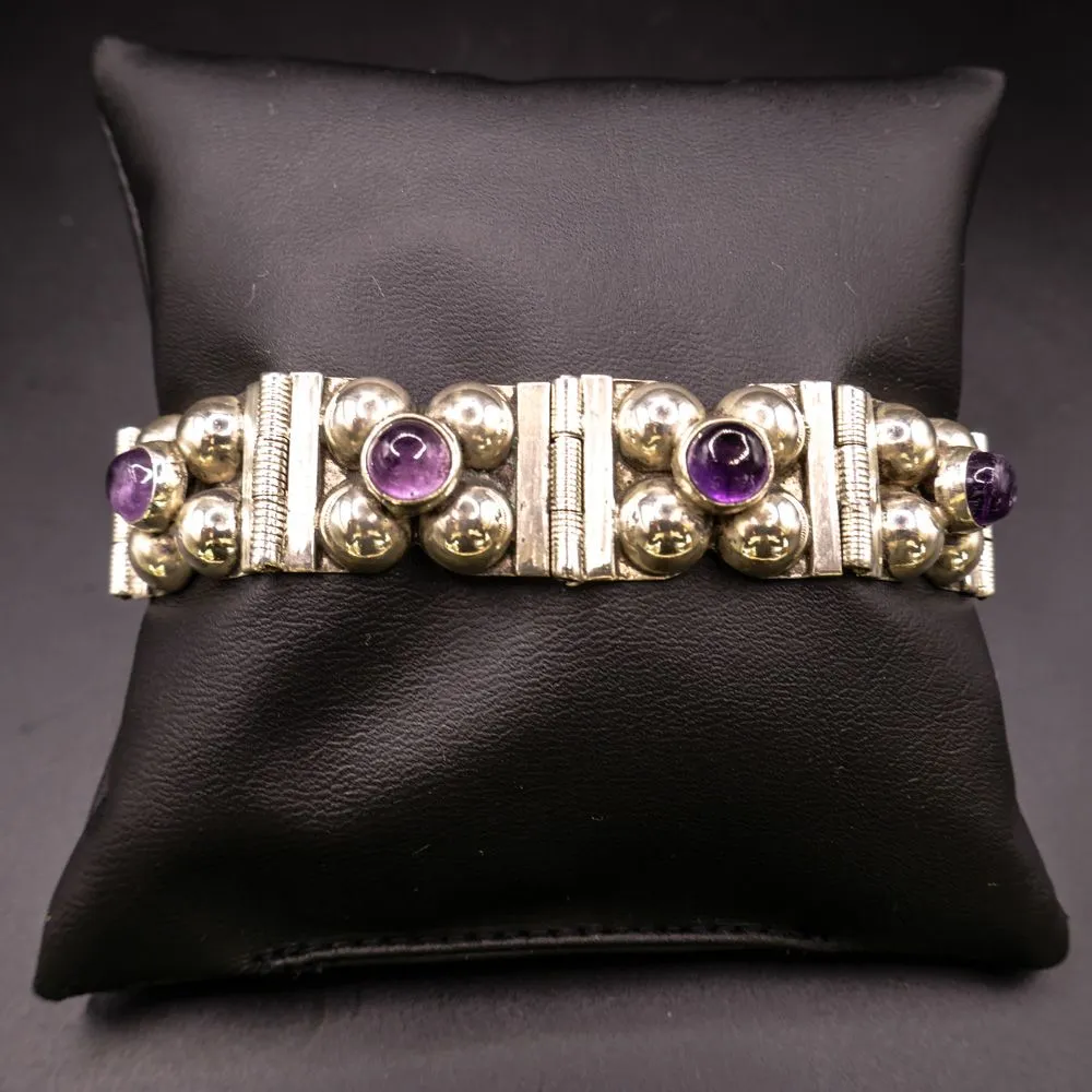 Vintage armlænke udført af sterling sølv og prydet med ametyster