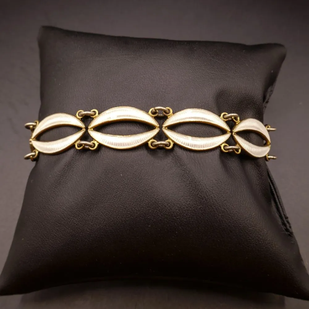 Forgyldt vintage armlænke i forgyldt sølv samt hvid emalje