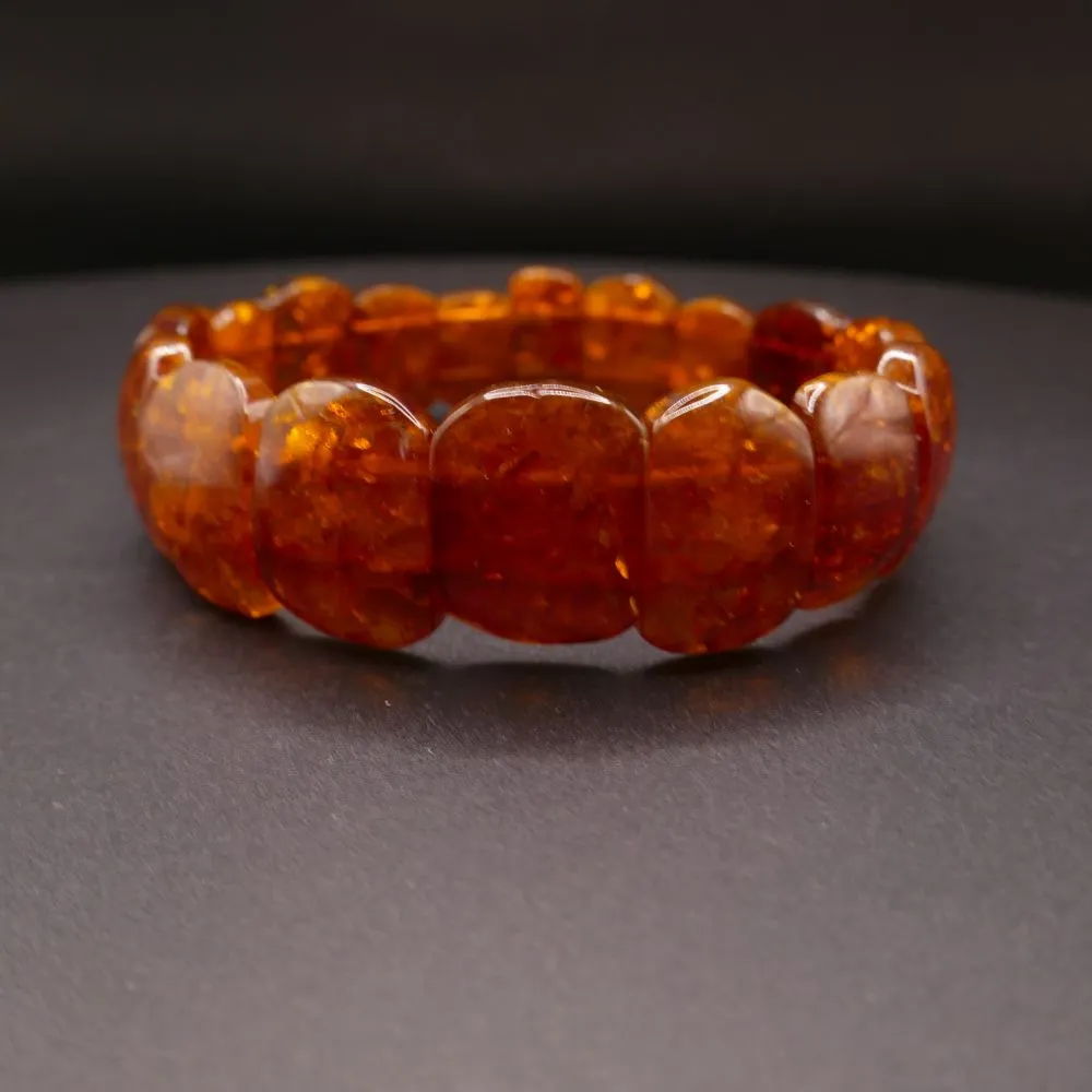 Vintage armbånd med let mørke polerede ravstykker.